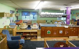 Infant room with cribs and play areas